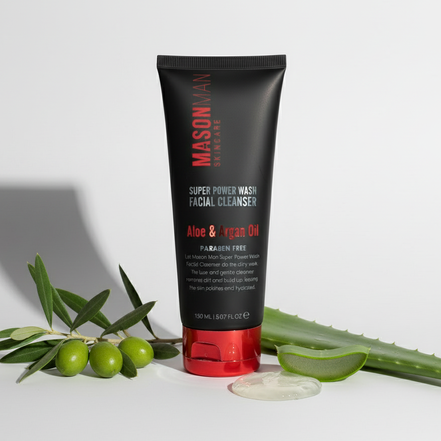 Mason Man facial cleanser tube with aloe vera leaves and olive branch on a light background