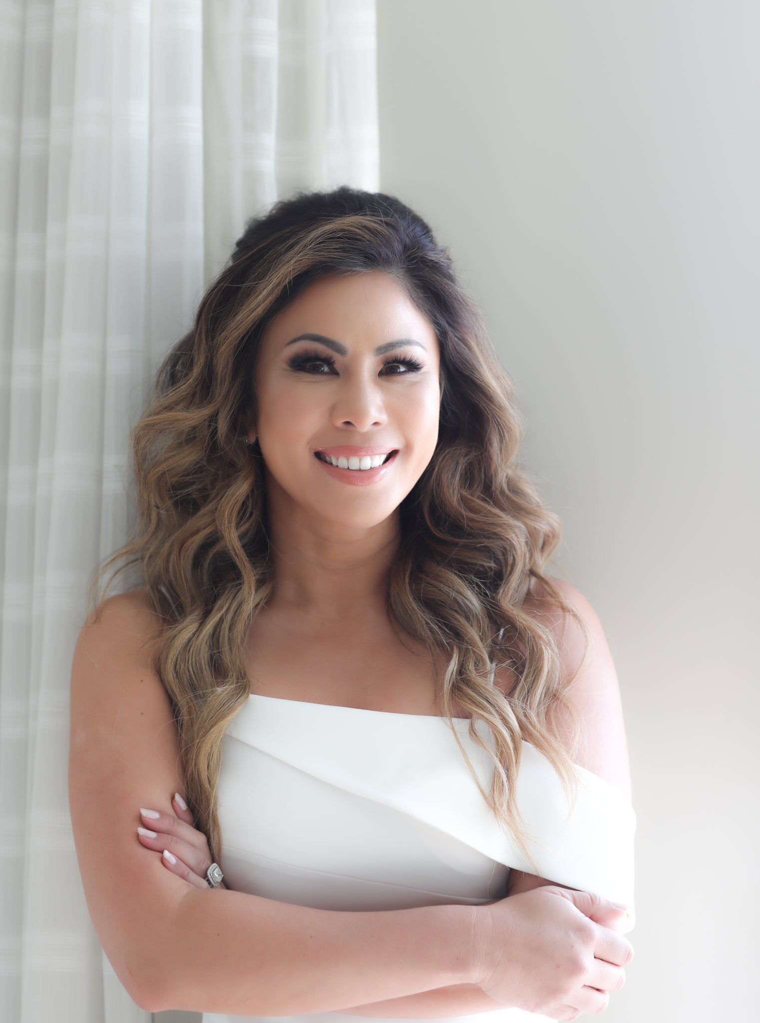 Manna Kadar in a white dress