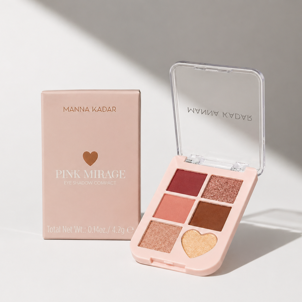 Makeup palette with heart design and open case on a light surface